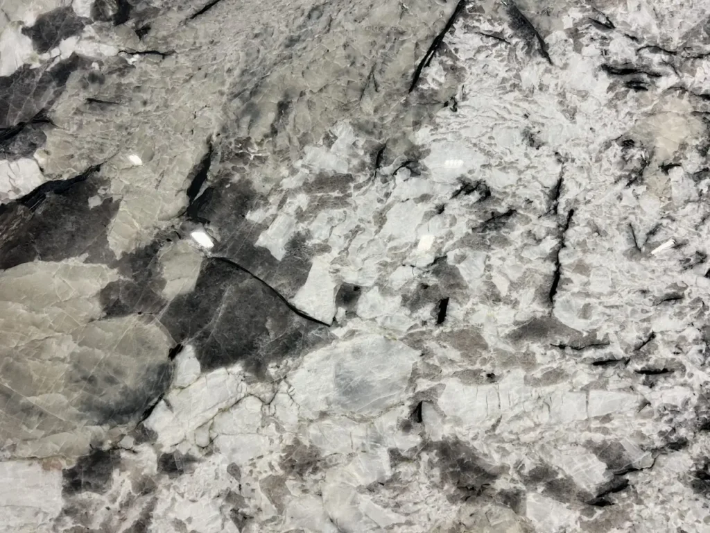 Close-up of an Arctic Glacier granite slab featuring dramatic white, gray, and black crystalline patterns available in Knoxville, Tennessee.