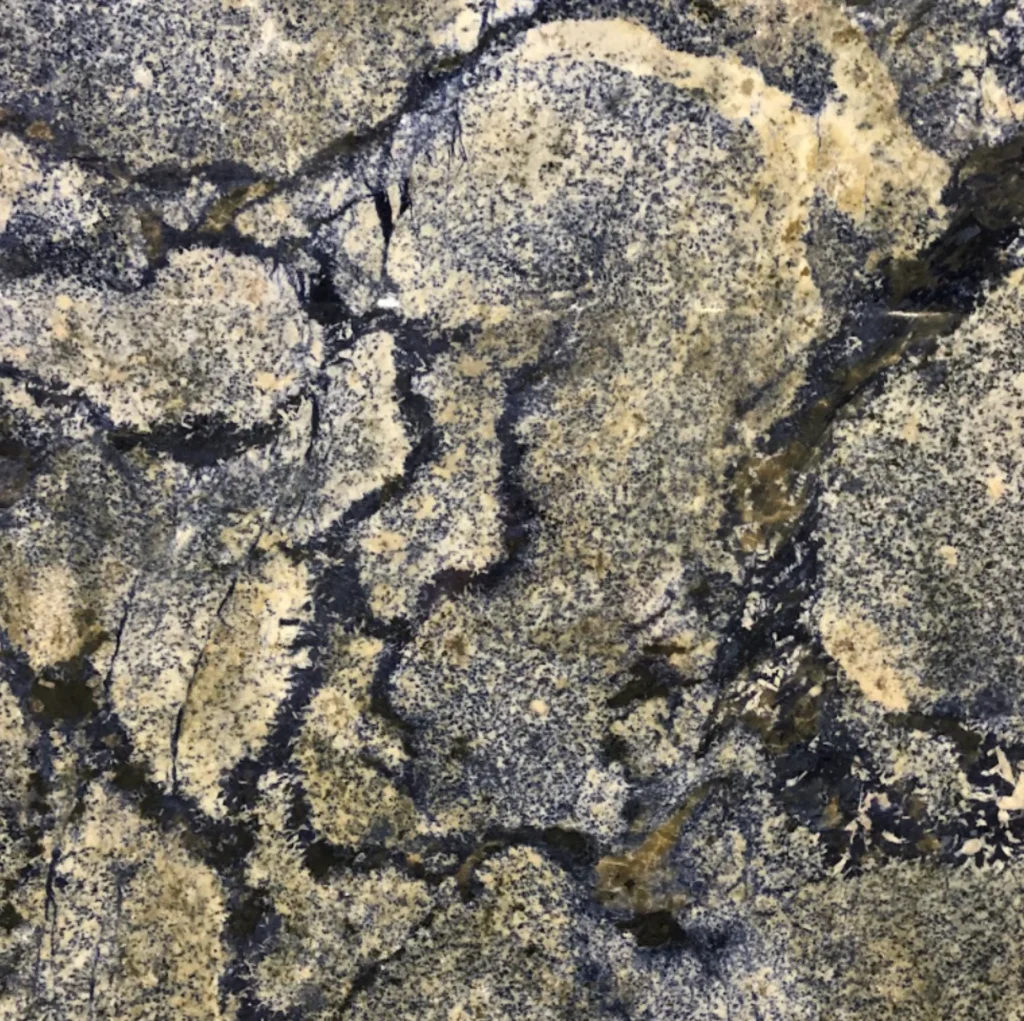 Close-up of an Azul Bahia granite slab featuring vivid blue, navy, cream, and black mineral patterns for luxury countertops in Knoxville, Tennessee.