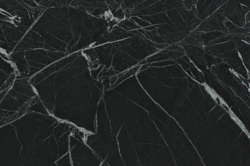 Close-up of a black soapstone slab with natural white veining available in East Tennessee.