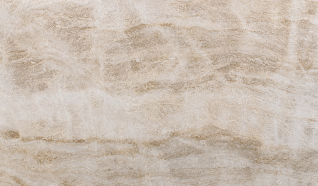 Close-up of a Taj Mahal quartzite slab with soft beige veining available in East Tennessee.