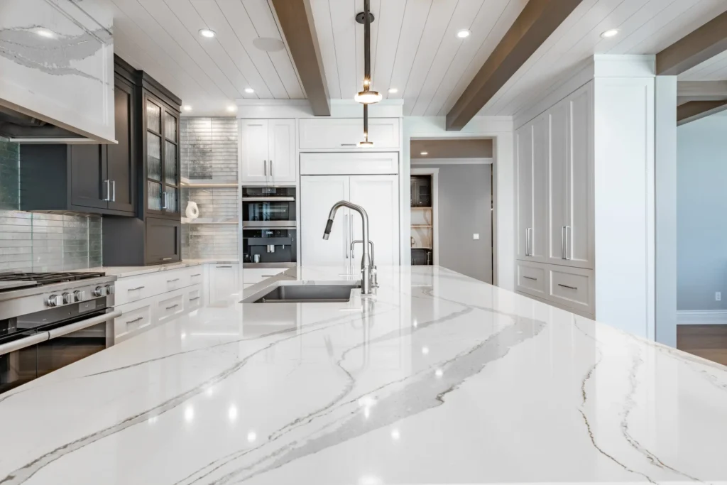 Modern Calacatta quartz kitchen island and countertops installed in an East Tennessee home