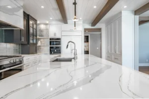 Modern Calacatta quartz kitchen island and countertops installed in an East Tennessee home