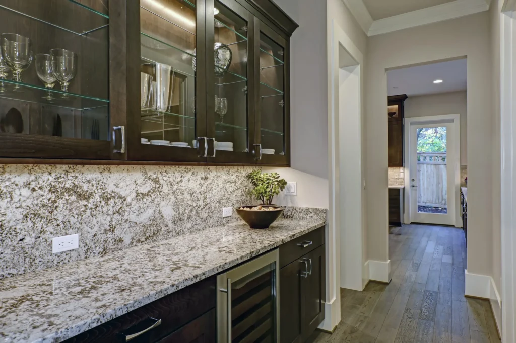 Custom quartzite countertop and backsplash installed in a home bar area in East Tennessee