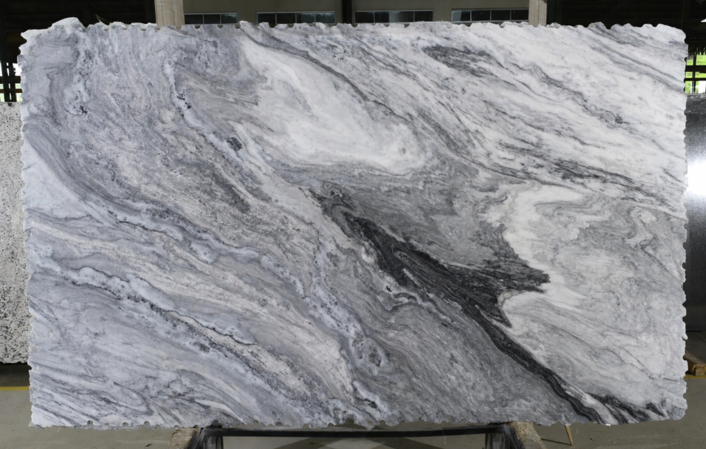 Mont Blanc marble slab with dramatic white, gray, and charcoal flowing veining for custom countertops.