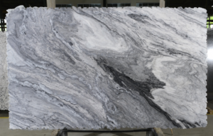 Mont Blanc marble slab with dramatic white, gray, and charcoal flowing veining for custom countertops.